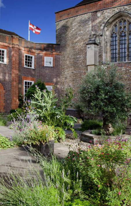 ALT="View of the Cloister Garden adjoining the Priory Church of the Order of St John, a popular space for receptions and parties"