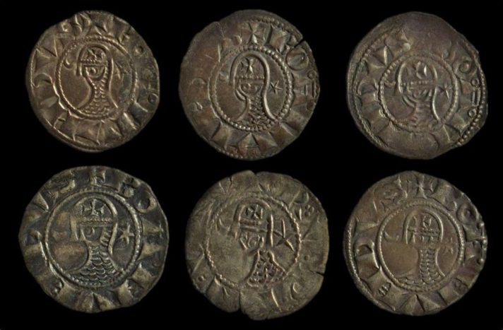 6 crusader coins on a black background