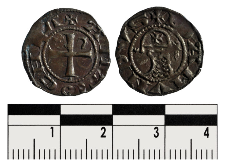 Two sides of a coin. One with a cross and legend around the edge. The other side showing a bust in armour facing left, with an inscription around the edge.