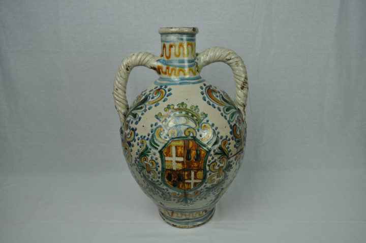 elaborately decorated two-handed amphora jar with a coat of arms in the middel