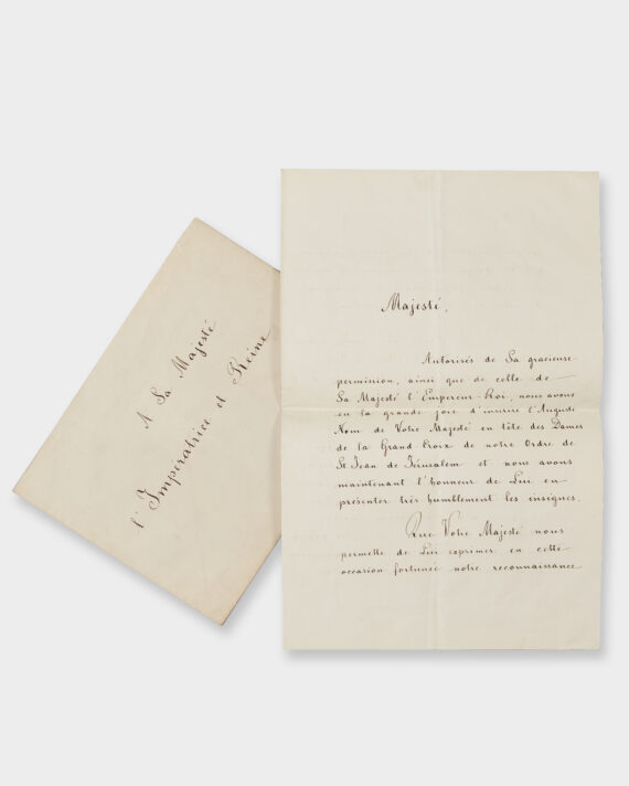 A handwritten letter in French, with the front of an accompanying envelope displayed