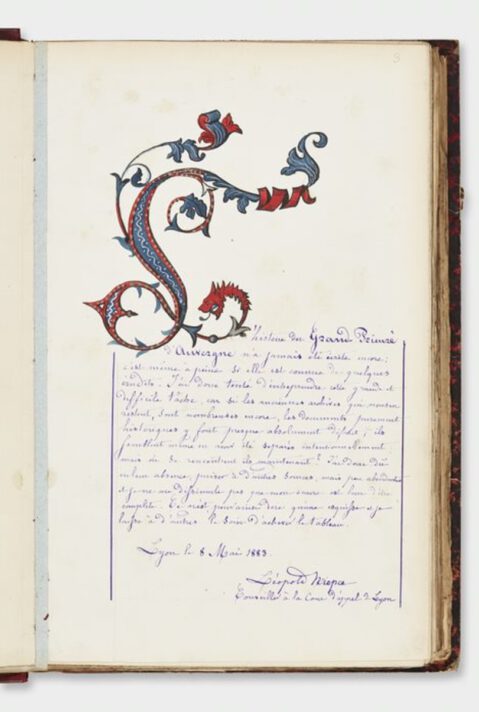 Photograph of a page from a book with an ornate illuminated L followed by handwritten text in blue ink.