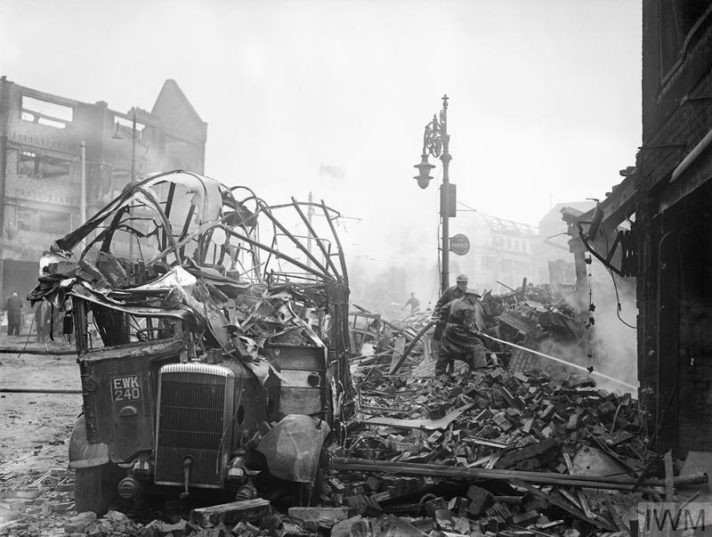A wrecked bus stands among a scene of devastation in the centre of Coventry after the major Luftwaffe air raid on the night of 14/15 November 1940.