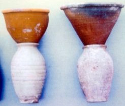 ALT="two white ceramic pots with brown conical pots on top"